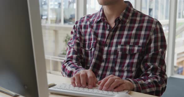 Young man working in a creative office