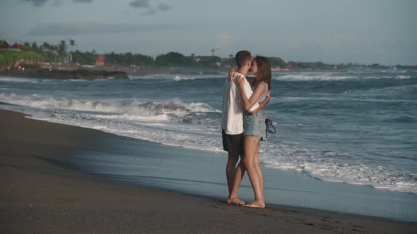 Couple Dancing Near Sea Waves Crashing