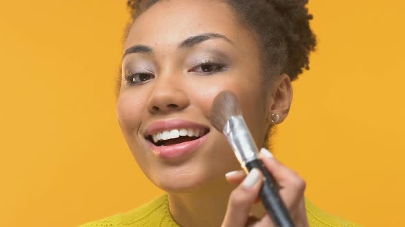 Smiling African Woman Applying Blush by Make-Up Brush, Beauty Trends, Fashion