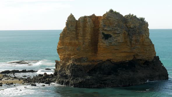 Limestone stack located at an Australian coastal beach. STATIC SHOT. COPY SPACE.