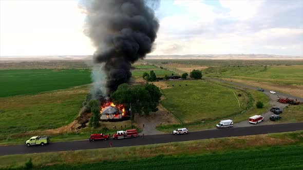 Aerial footage of house burning down