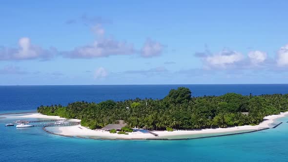 Aerial view texture of resort beach by blue water with sand background