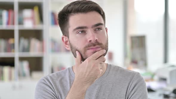 Portrait of Pensive Young Man Thinking New Idea