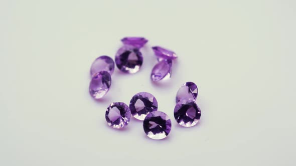 Natural Amethysts Spin on the White Background