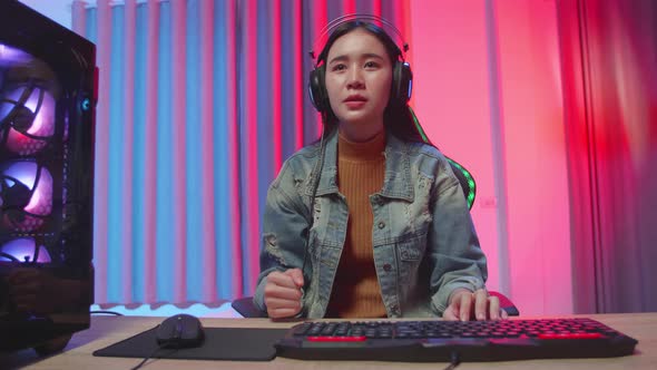 Asian Girl Gamer Lose While Playing Video Game On Computer