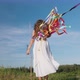 Teenage Girl with Rainbow Ribbons on Nature - VideoHive Item for Sale