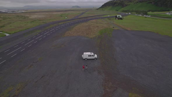 Drone Towards Couple Walking Towards Van In Thingvellir