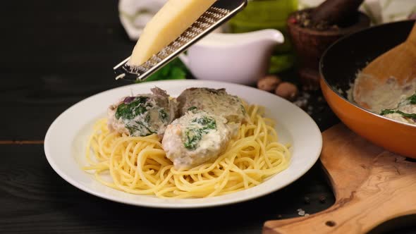 Portion of Delicious Meatballs with Spinach in a Creamy Sauce