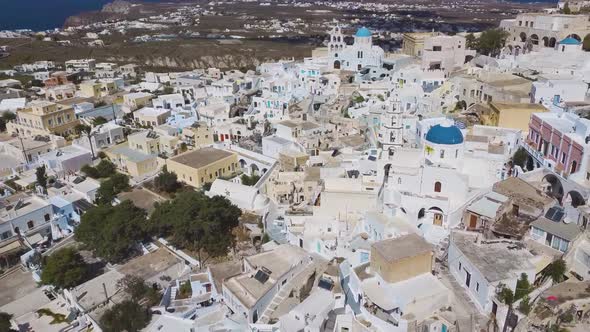 4k aerial drone view of Pyrgos Pirgos Santorini white houses greek island