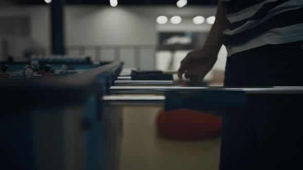 Energetic Boy Hands Playing Table Football Close Up