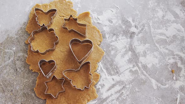 Gingerbread dough with flour and cookie cutter