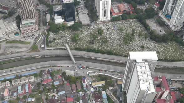 Aerial view of bridge, river, highway and graveyard in Kuala Lumpur