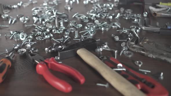 Bolts Nuts Screws Hand Tools on the Table