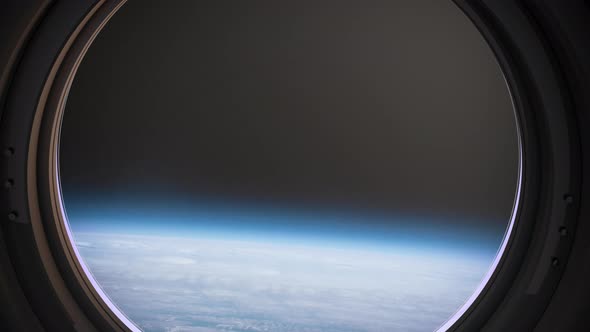 Earth As Seen Through Window Of Spaceship, Flight Of The Space Station Above The alt