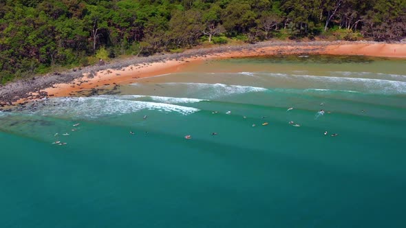 Splashing Surfing Waves With Surfers In Noosa National Park Near Noosa Heads, QLD Australia. Aerial