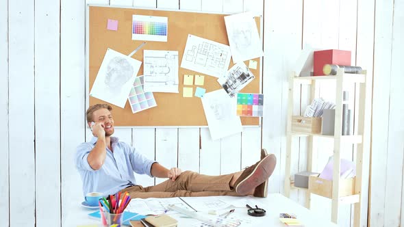 Young Successful Architector Smiling Speaking on Phone at Workplace in Office