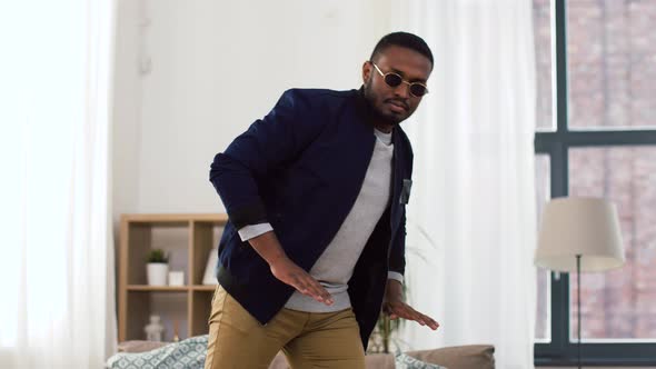 Young African American Man Dancing at Home