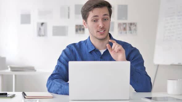 Online Video Chat by Casual Man at Work