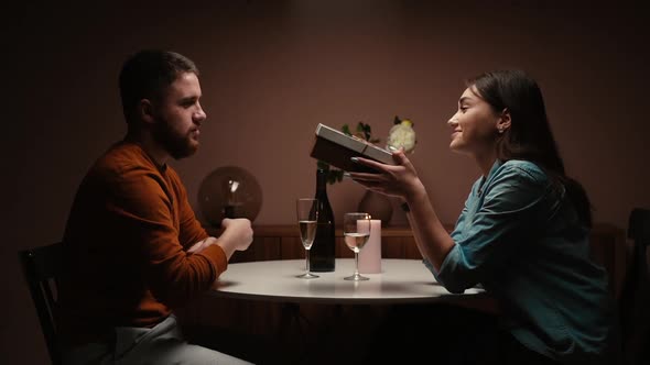 Charming Wife Giving Congratulatory Speech and Gives Gift To Husband on Birthday or Valentine's Day