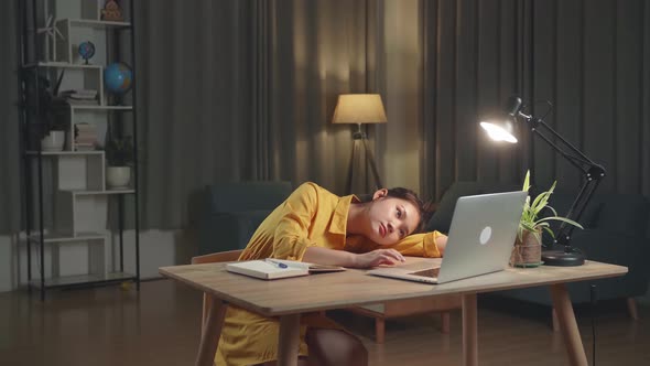 Asia Businesswoman Bored While Working From Home At Living Room At Night