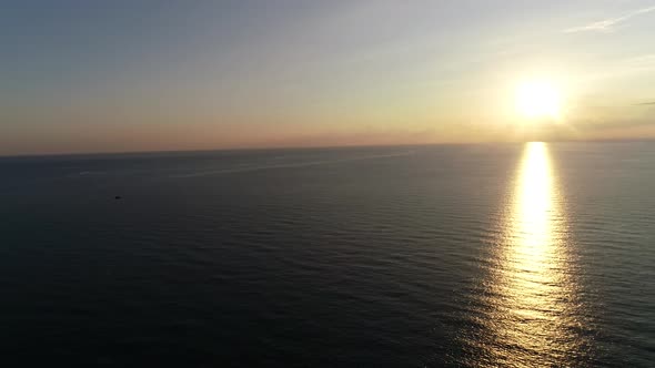 Flying Over The Sea at Sunset