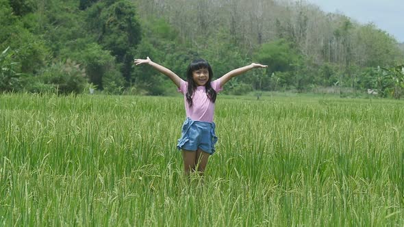 Little Girl Happy In Rice Field