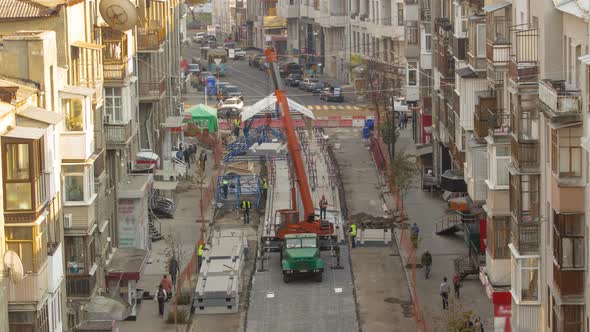 Unloading Concrete Plates From Truck By Crane at Road Construction Site Timelapse