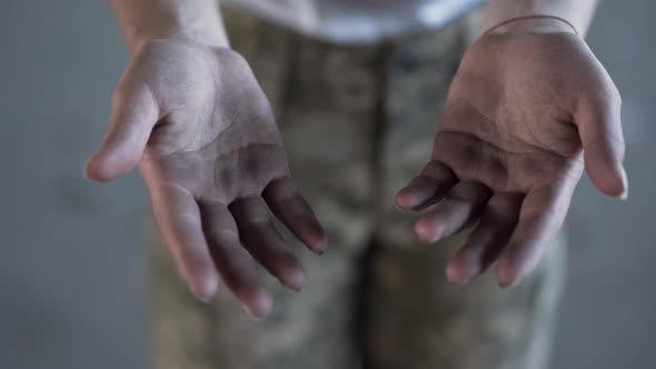 Dirty Hands of Young Woman in Military Uniform After Training