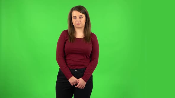 Pretty Girl Worrying in Expectation Then Guilty Hides Her Eyes. Green Screen