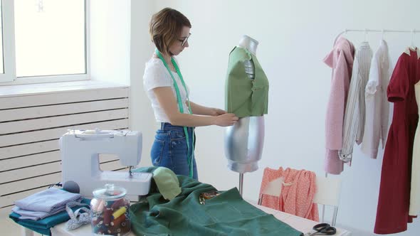 Dressmaker, Tailor and Fashion Concept - Female Clothing Designer at Workplace in Studio