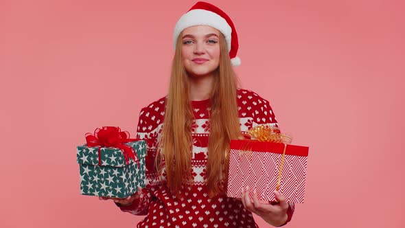 Woman in Christmas Red Sweater Santa Hat Smiling Holding Two Gift Boxes New Year Presents Shopping