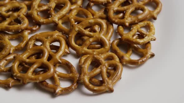 Rotating shot of Pretzels on a white plate - PRETZELS 004