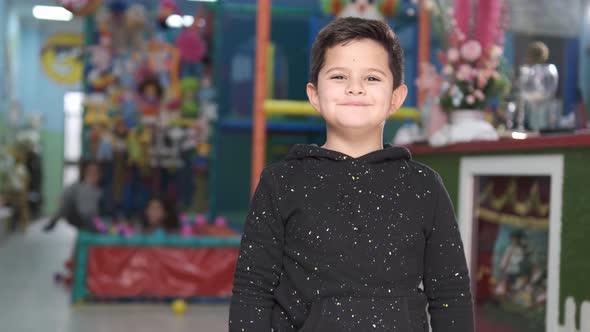 5-year-old girl smiling in children's playground