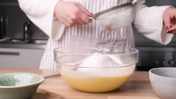 Baker Preparing Ingredient Mix for Carrot Cake Batter - Slider Left