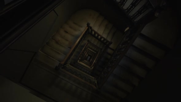 Ascending Top Down View of Old Wooden Staircase Leading in the Darkness