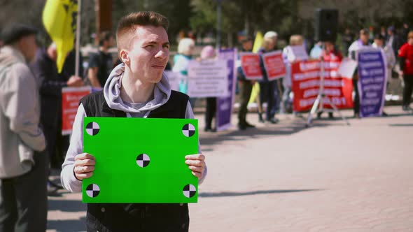 Guy on Demonstration Standing Hold Chroma Key Table