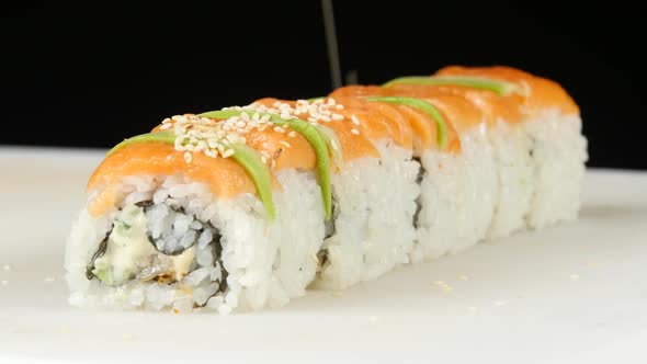 Sushi Chef Sprinkles Rolls By Sesame. Close Up