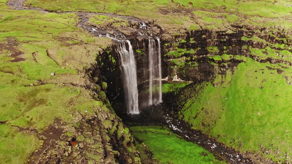 Aerial View of Stunning Waterfall in Faroe Islands