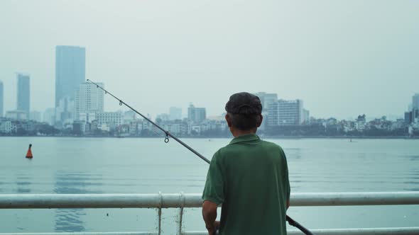 Handheld view of senior man fishing. Shot with RED helium camera in 8K