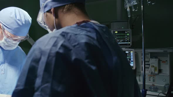 African Anesthesiologist Working in Surgery Room