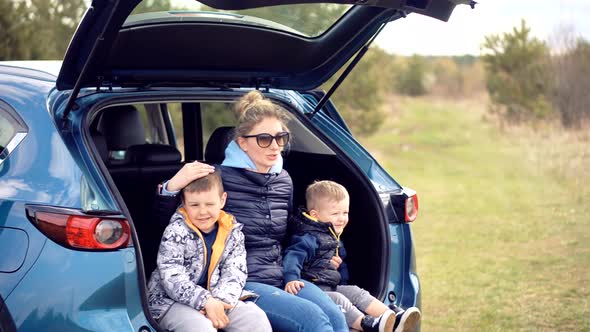 Happy Family Mother And Child Boys Leisure. Son Boys Walking Happiness. Cute Little Kid Having Fun.