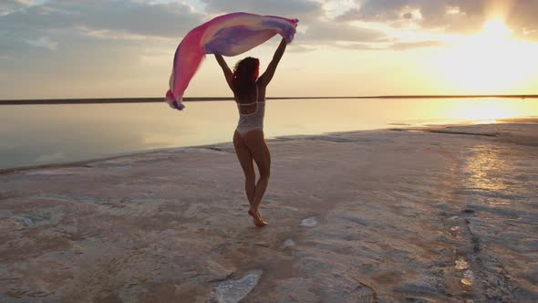 Beautiful Beach During Summer, Young Woman Is Dancing with Pareo Fluttering, 