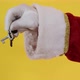 Santa Claus holding keys of new house or apartment on yellow background. - VideoHive Item for Sale