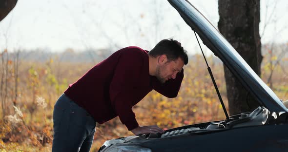 Sad Disappointed Man on Broken Car Accident