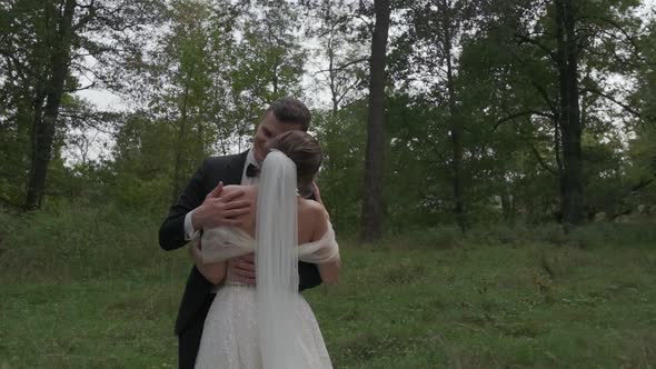 The Bride and Groom are Dancing in the Forest