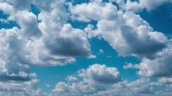 Timelapse of Light White Puffy Clouds Moving in the Blue Sky Cloud Space