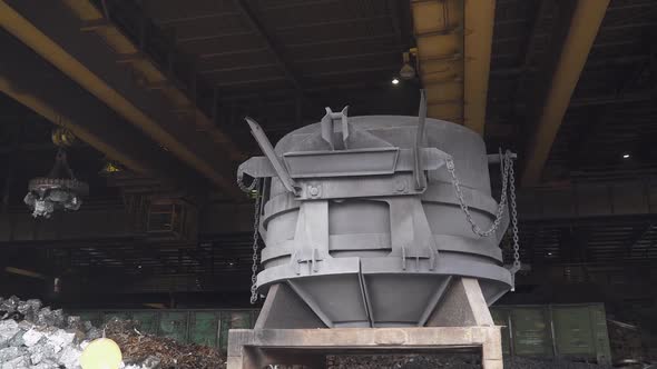 Steelmaking the Process of Loading Scrap Metal Into a Tank for Steel Melting Gantry Cranes with