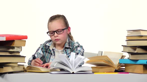 Girl Carefully Read and Write Data To the Notebook. White Background