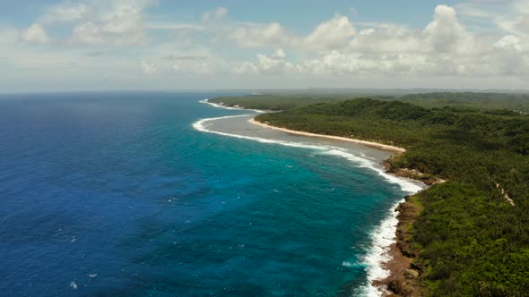 The Coast of Siargao Island, Blue Ocean and Waves