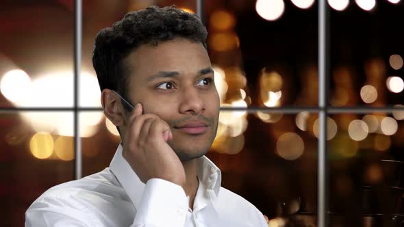 Close Up Businessman Talking on Glass Phone.